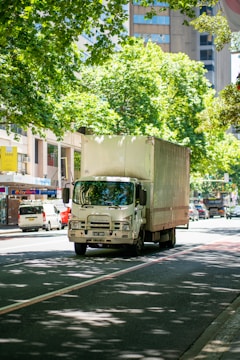 a truck driving down a street