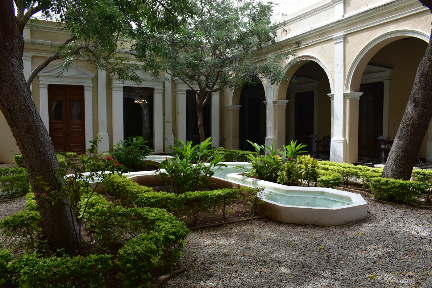 Hacienda property in Merida Yucatan Mexico with white walls and a pool showing the restored colonial estate architecture of the Yucatan Peninsula