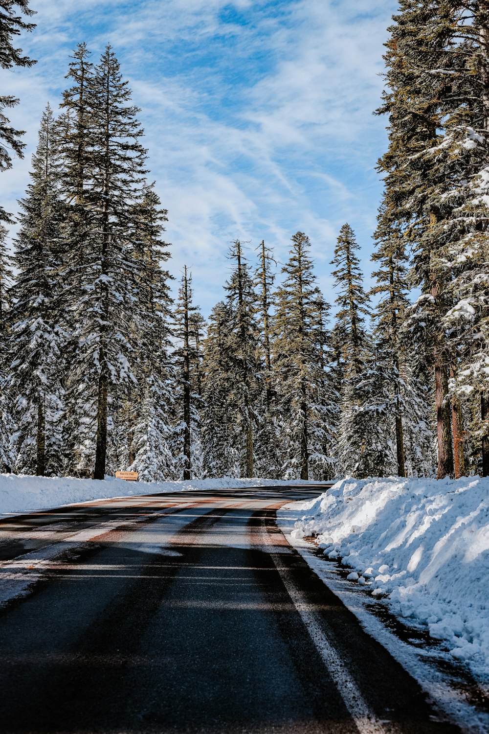 a road with snow on the side