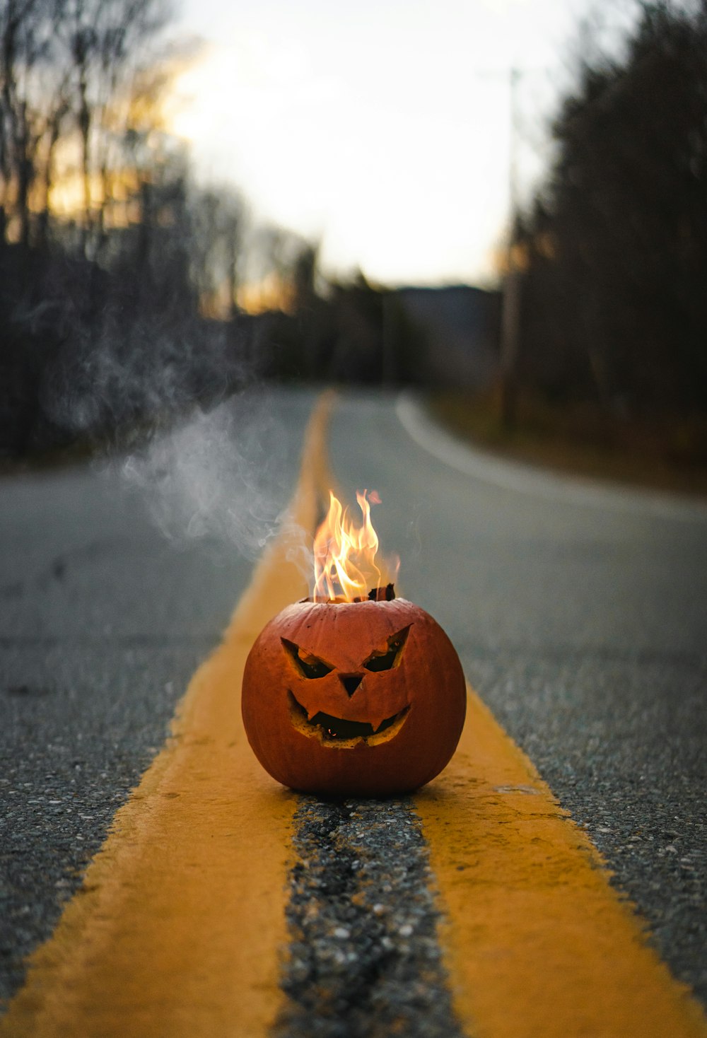a carved pumpkin on fire