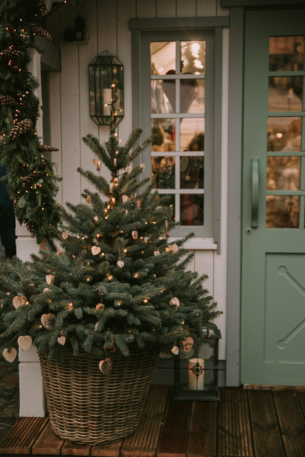 a christmas tree in front of a door