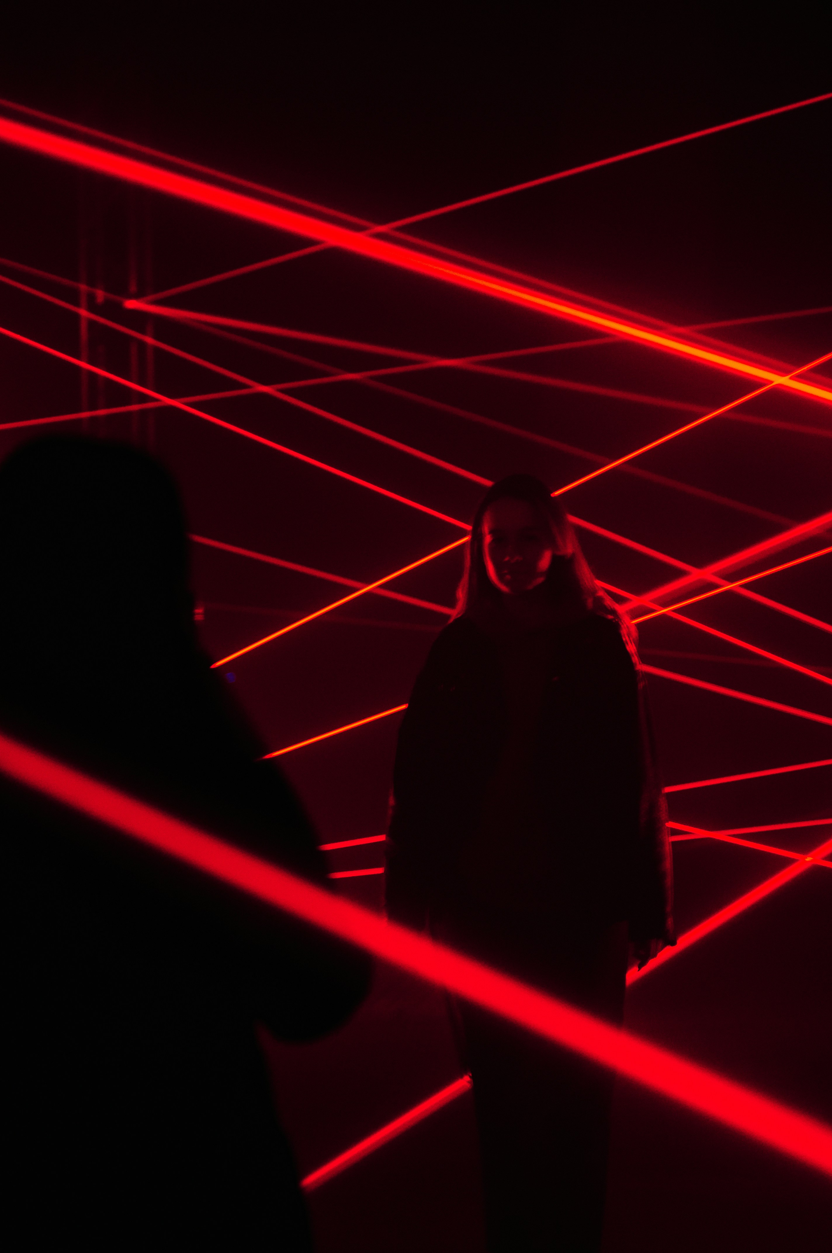 a person standing in a red light