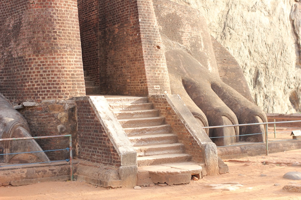 a stone staircase with a rock arch