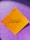 A yellow square paper with a motivational quote written in black script font is placed against a sparkly purple background.