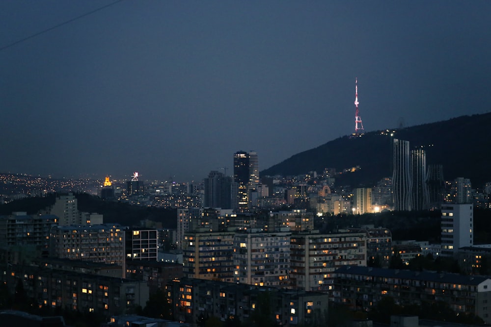 a city with a tall tower in the distance