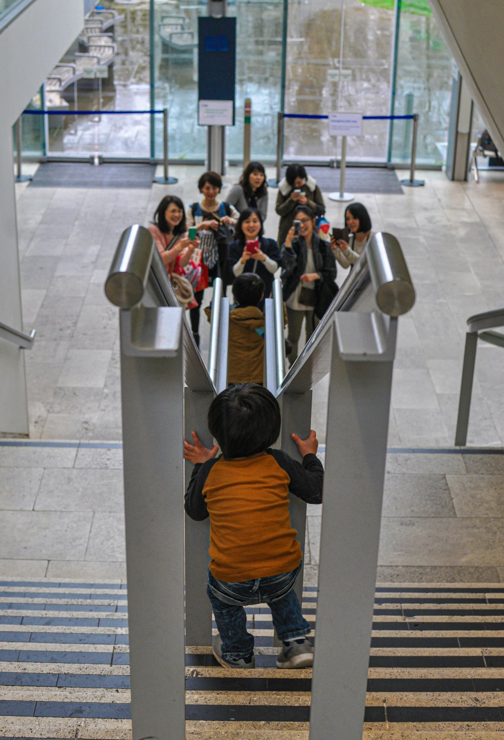 a group of people standing in a queue