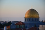 a domed building with a gold roof