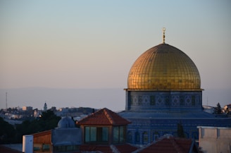 a domed building with a gold roof