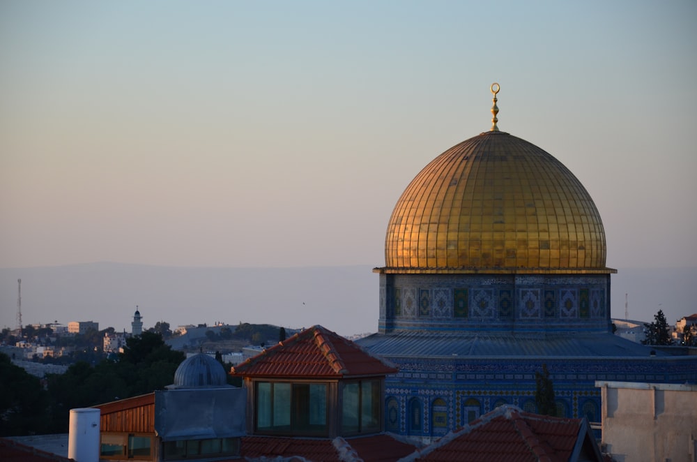 a domed building with a gold roof