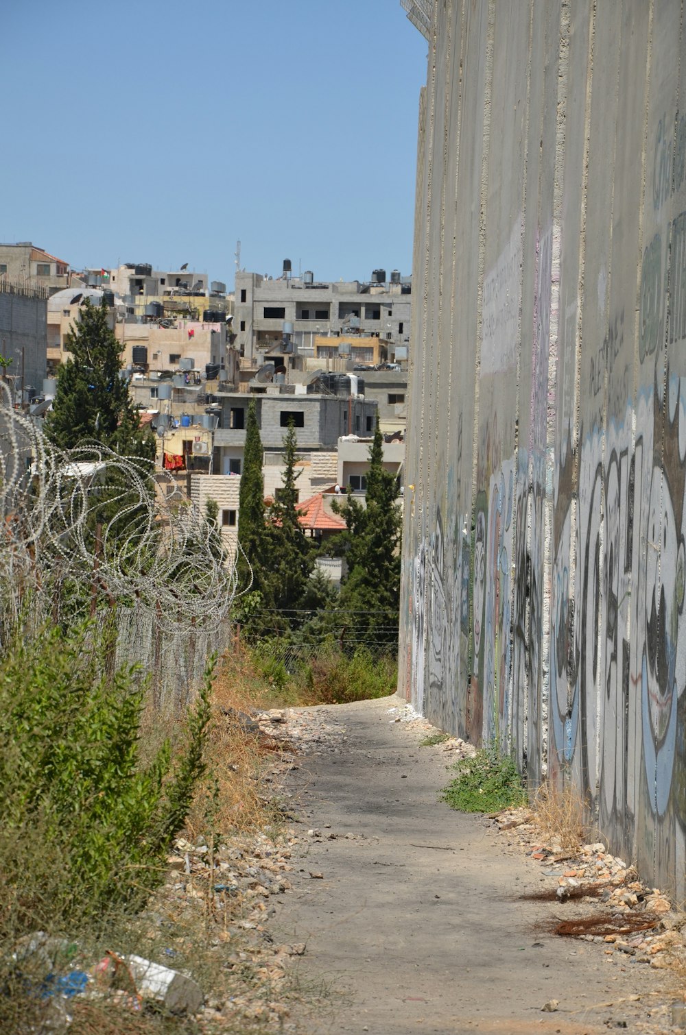 a path with buildings on the side