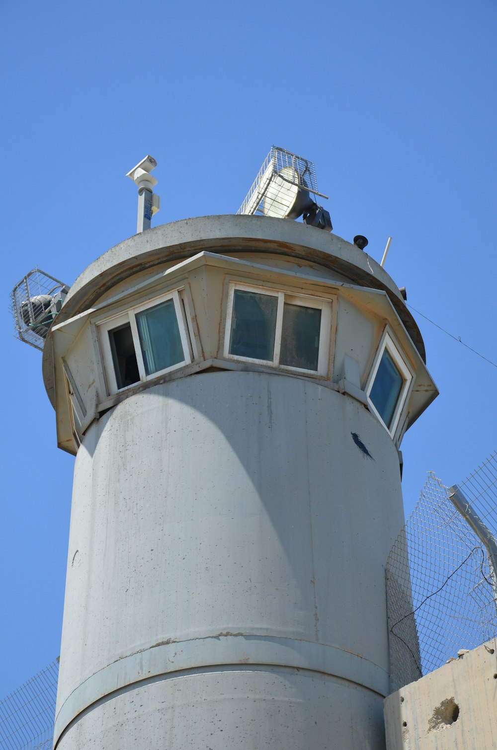 a white tower with a bell