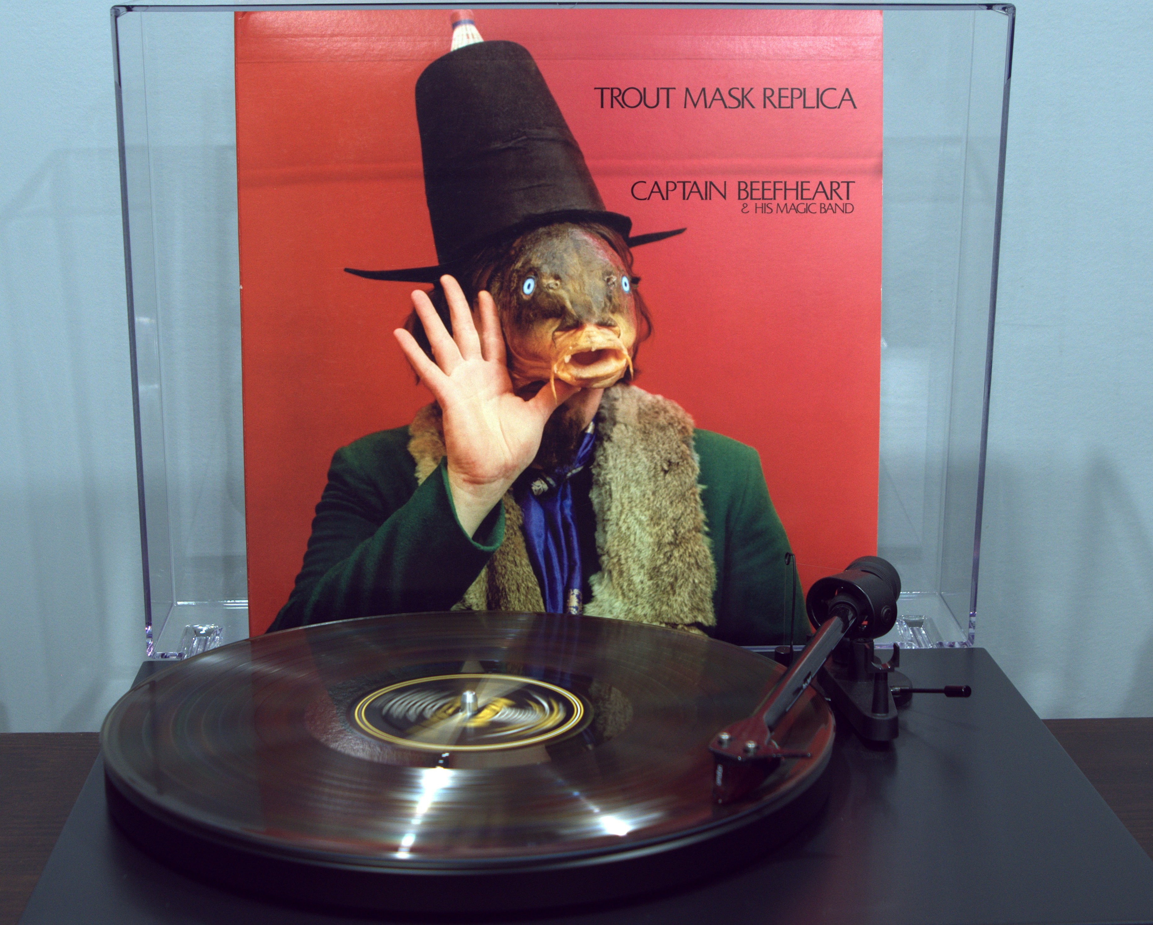 a person wearing a hat and holding the hand up