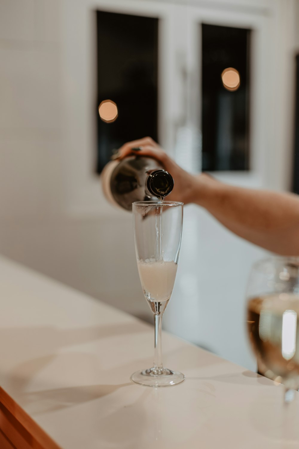 a person taking a picture of a wine glass