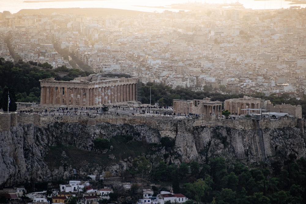 a large stone building on a cliff