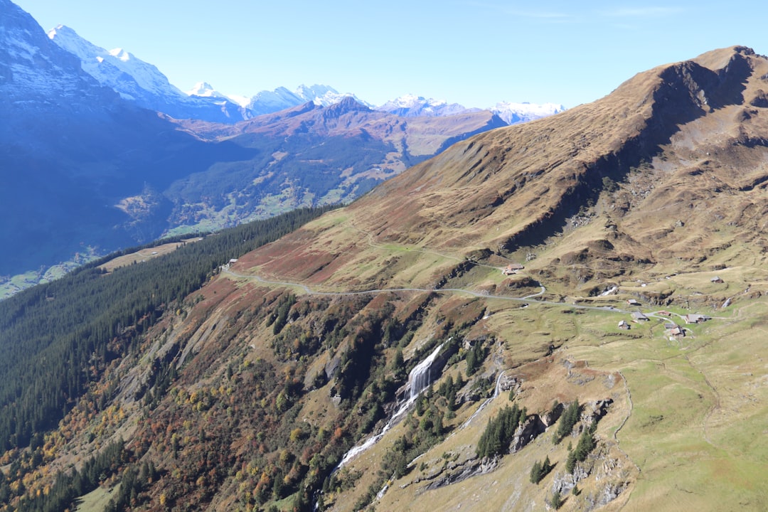 a river running through a valley between mountains,