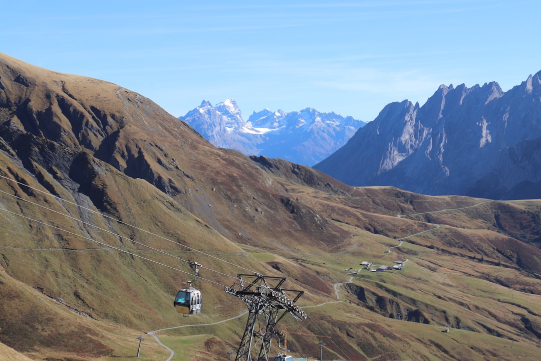 a cable car going up a mountain, 