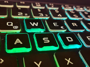 A clean illustration of hands typing on a keyboard with highlighted home row keys.