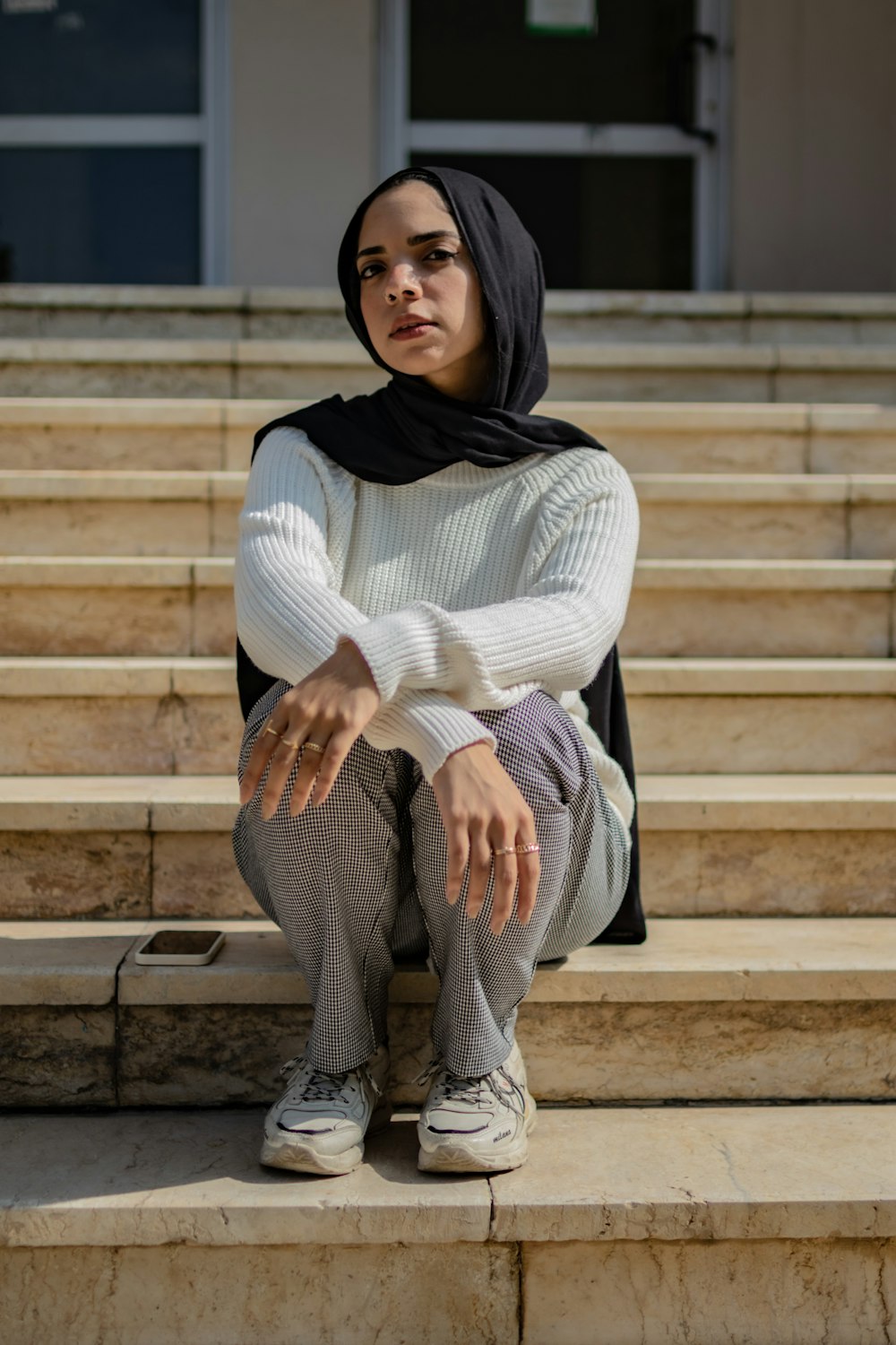 a person sitting on stairs