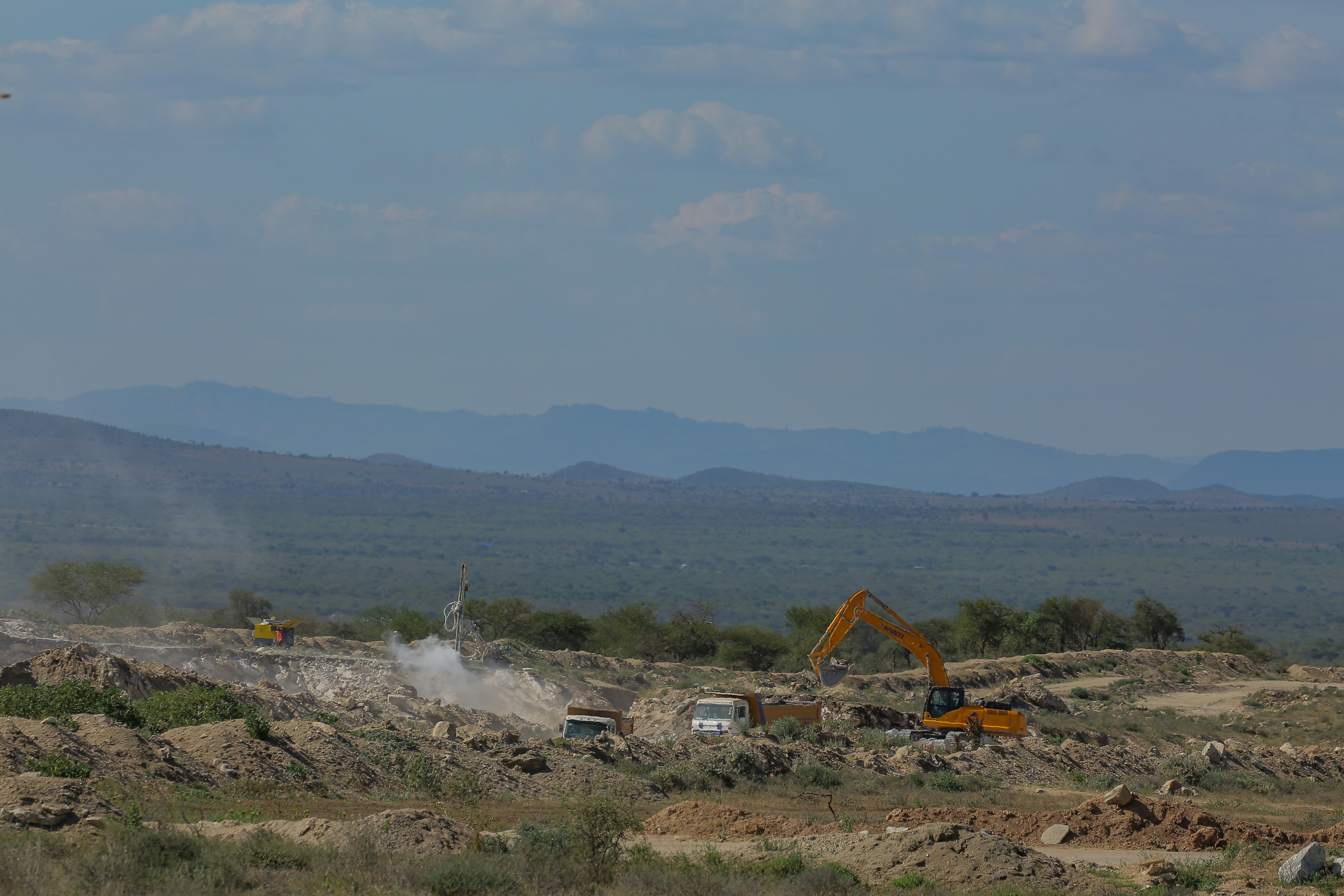 Construction vehicles in disorganized field