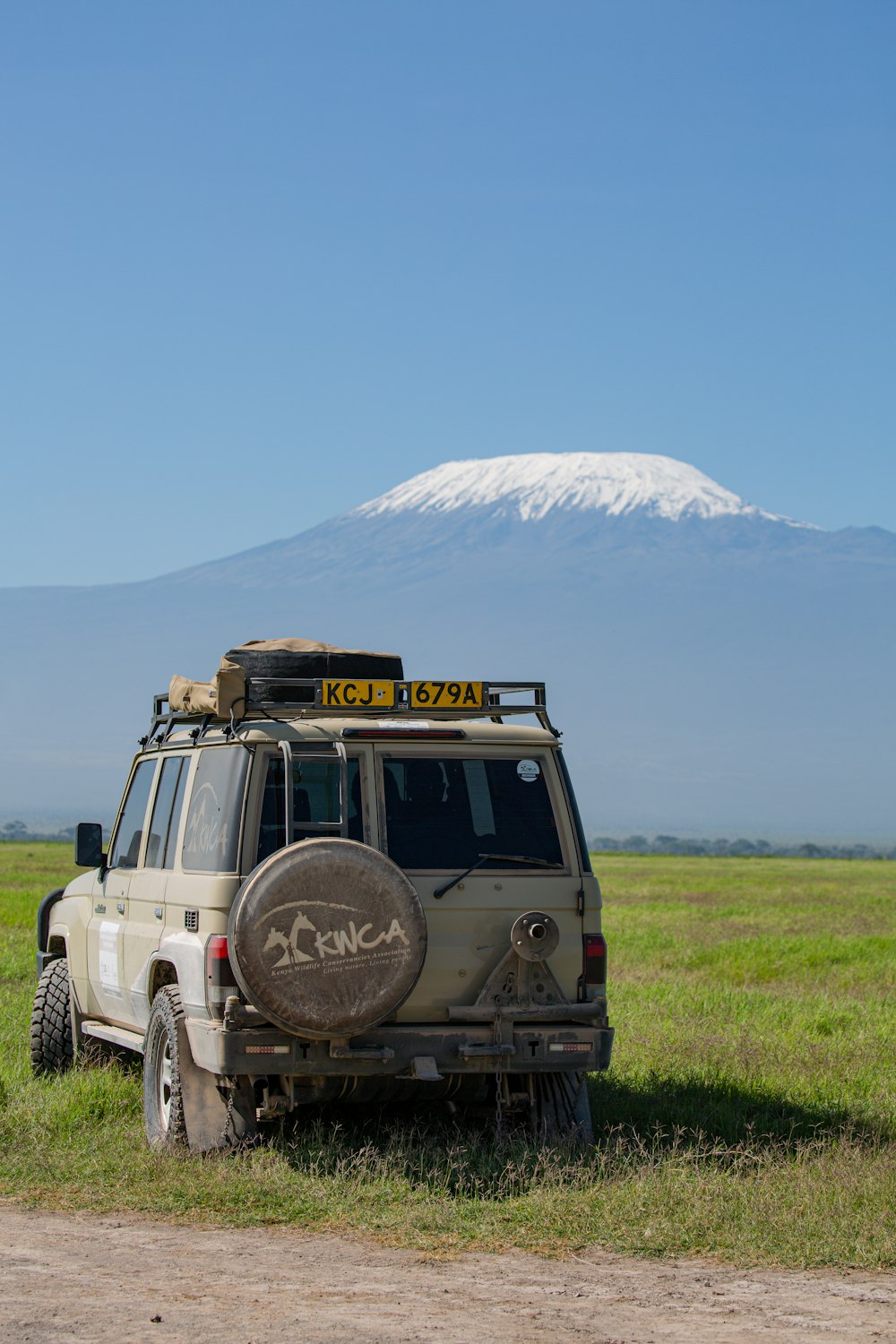 a truck with a mountain in the background