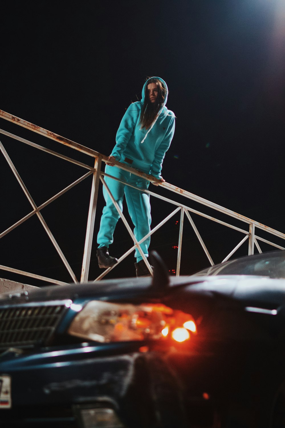 a person standing on a railing