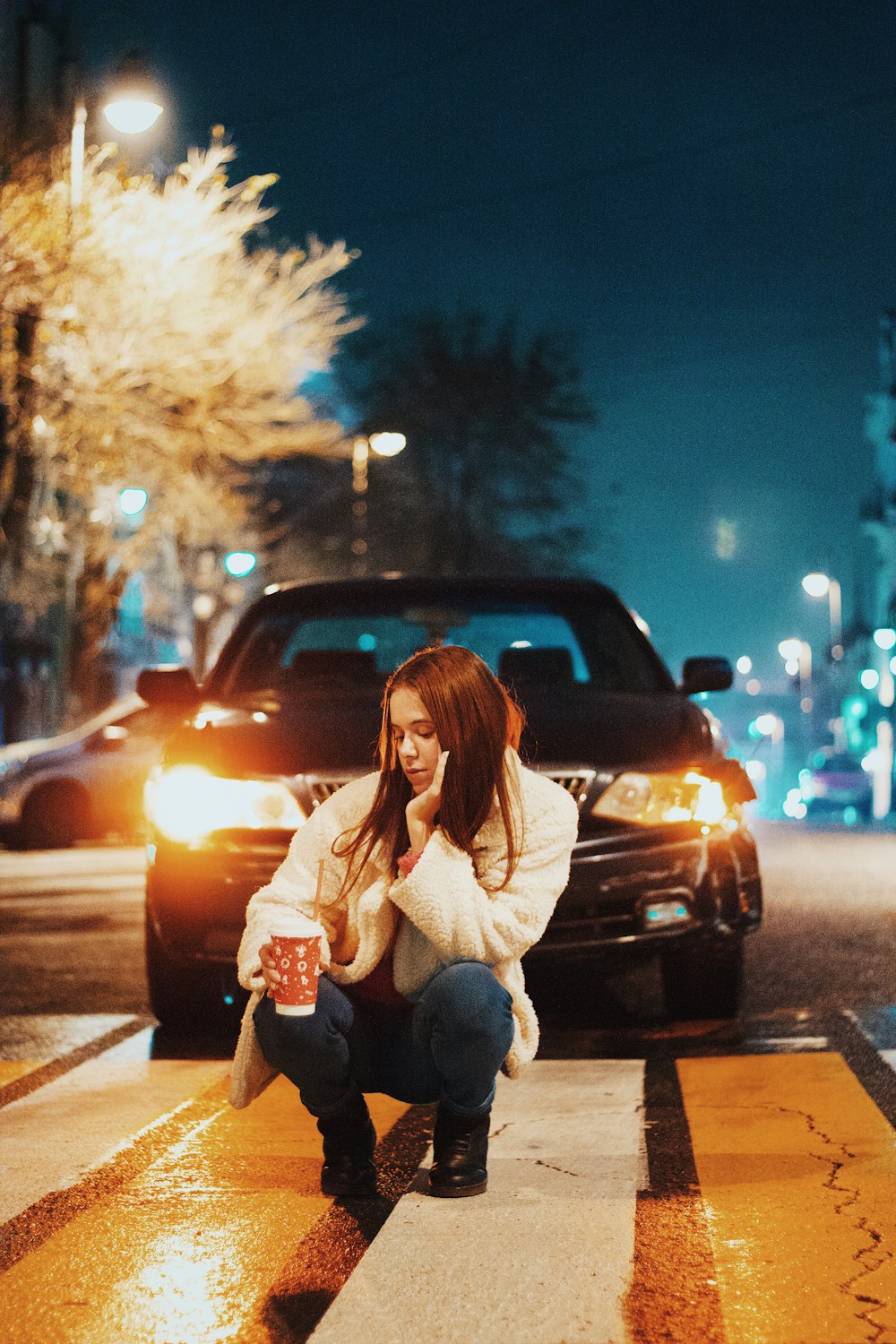 a person sitting on a curb