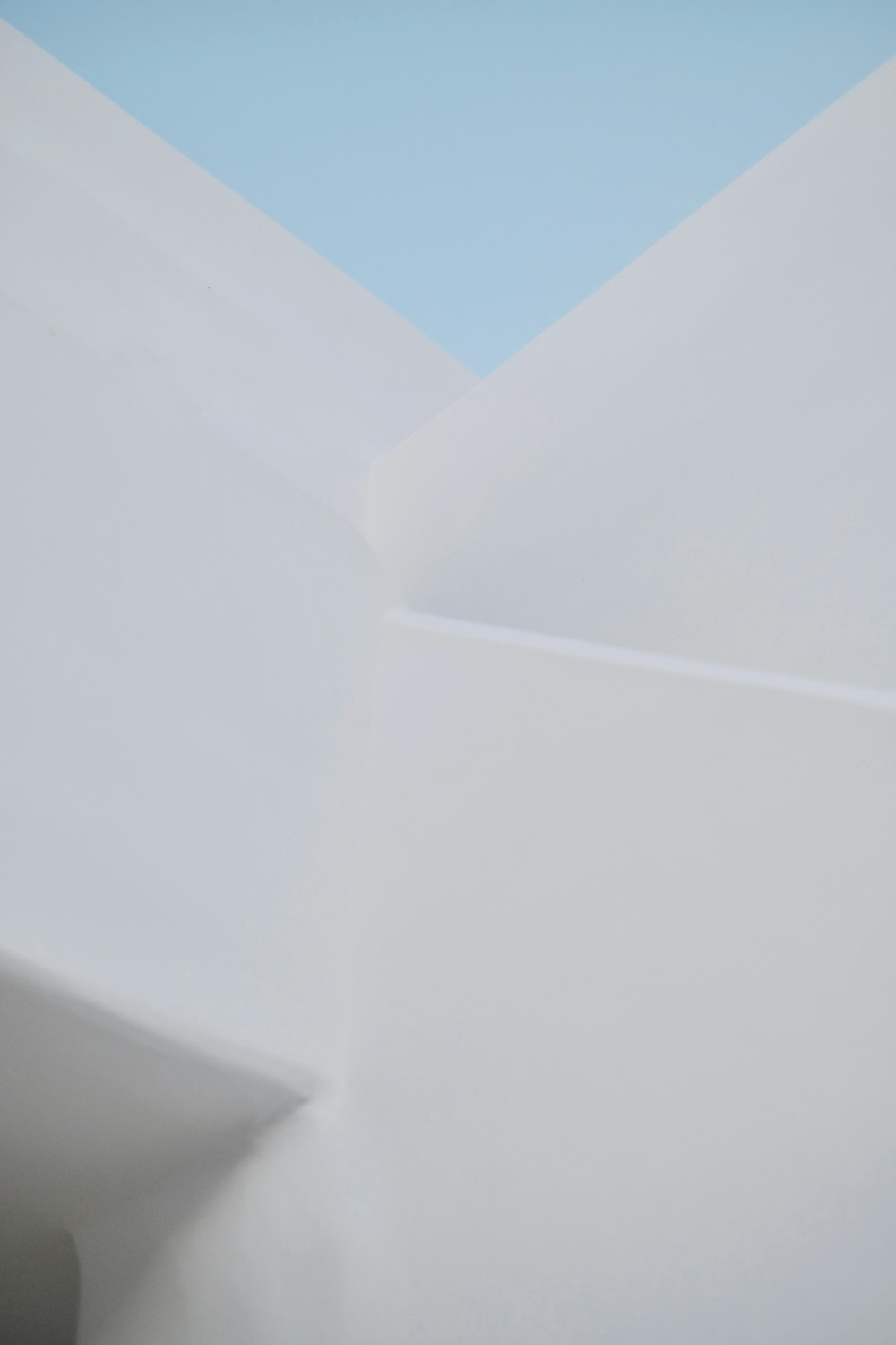 a white ceiling with a blue sky