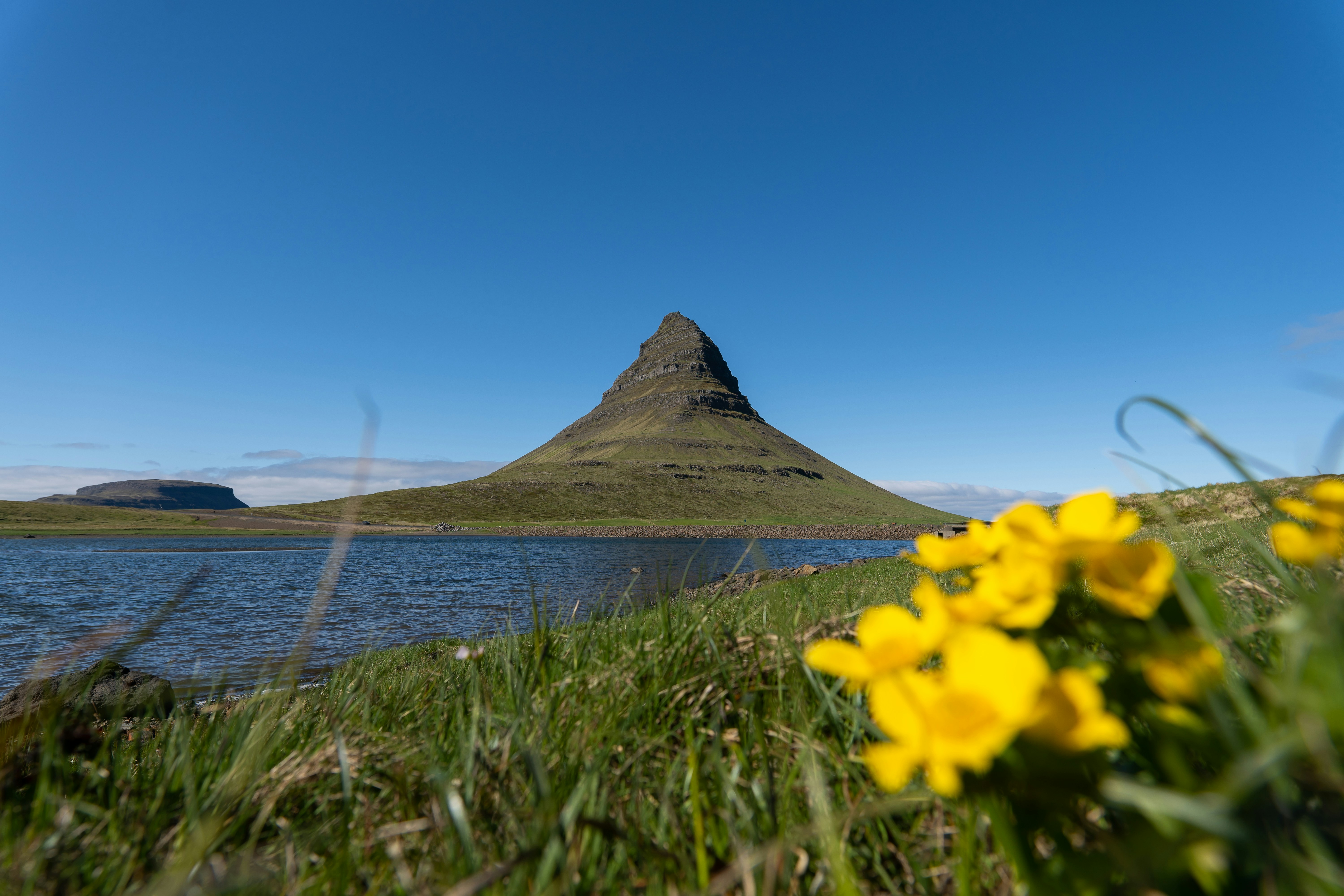 a pyramid in the distance, Kirkjufell in Iceland.