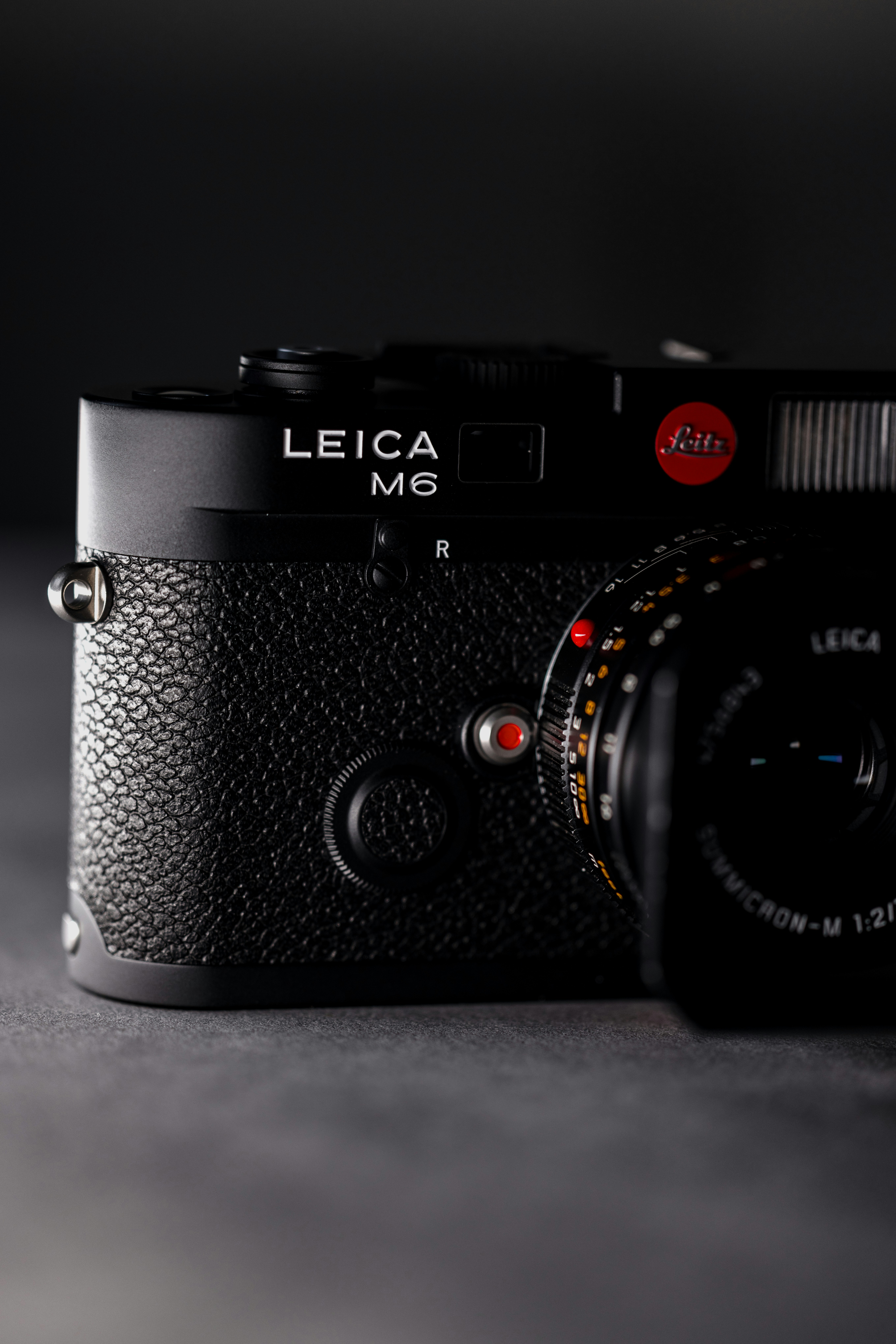 a black camera with red lights