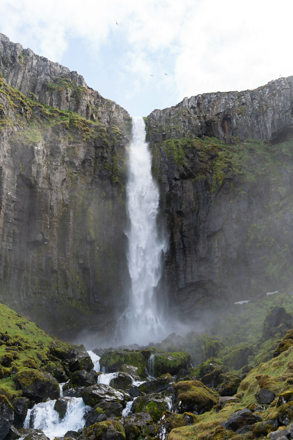 a waterfall over a cliff