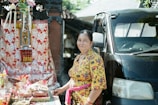 a person standing next to a car