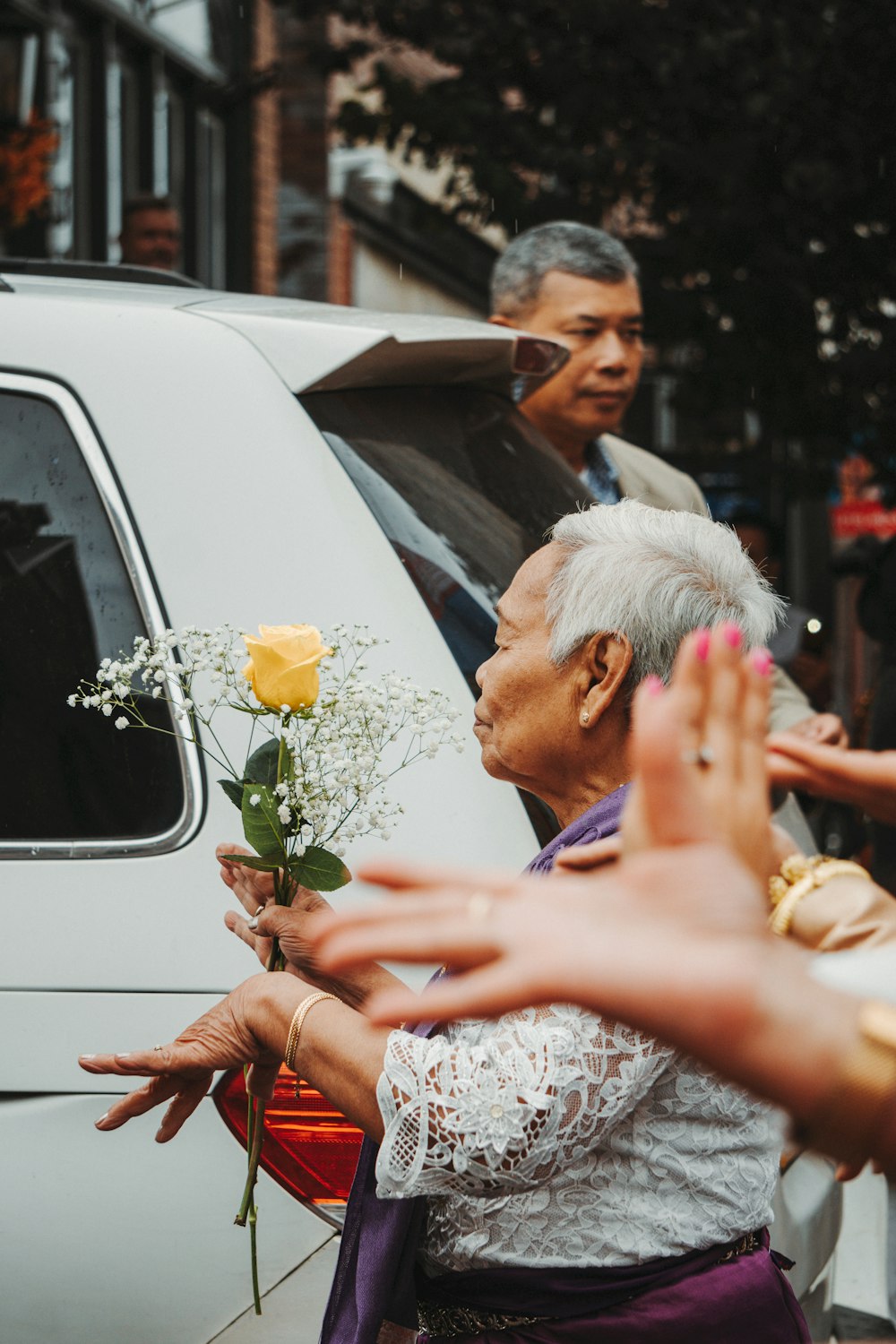 a person holding a flower