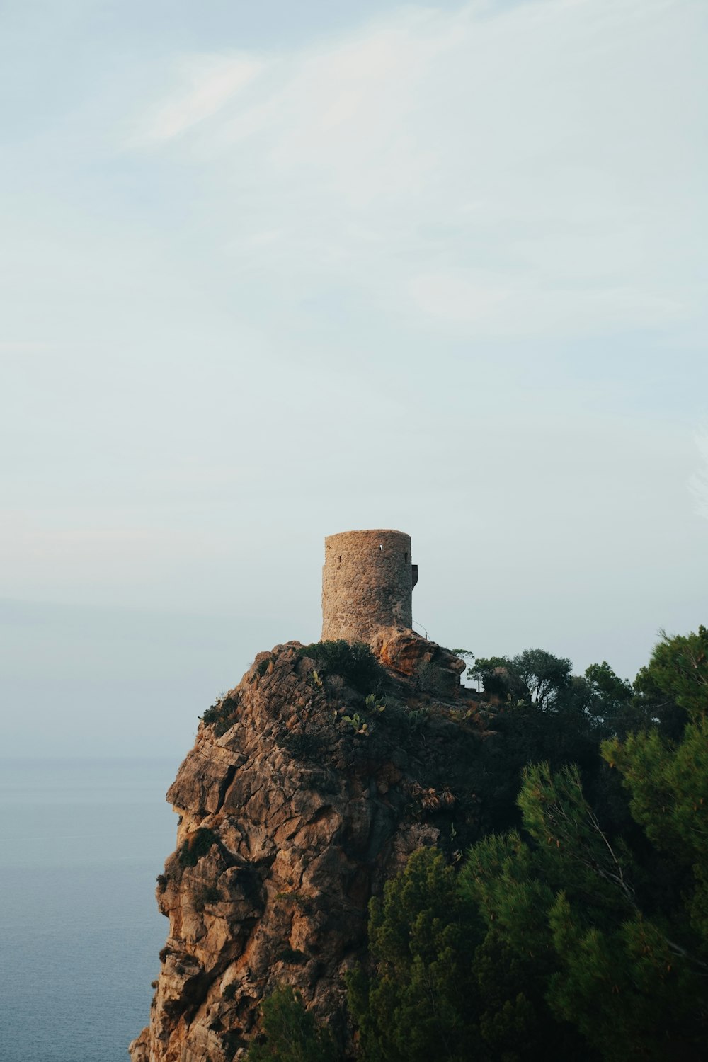 a stone tower on a cliff