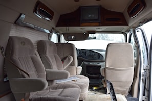 Side-angle shot of a modern van with the door open revealing clean seating