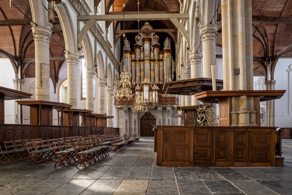 a large room with a large chandelier and chairs