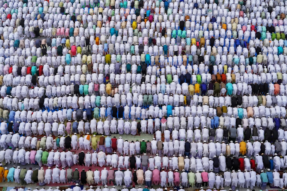 a large group of people wearing matching outfits