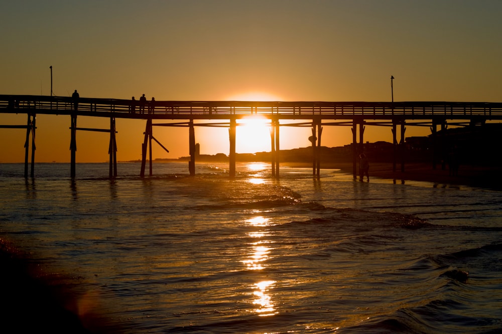 a sunset over a pier