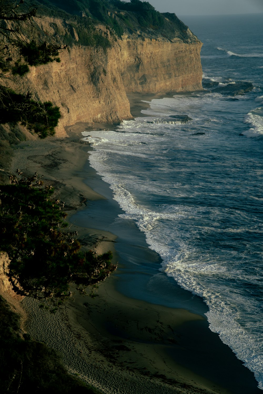 a cliff next to the ocean