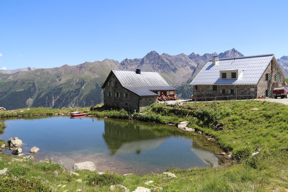 a small house next to a lake