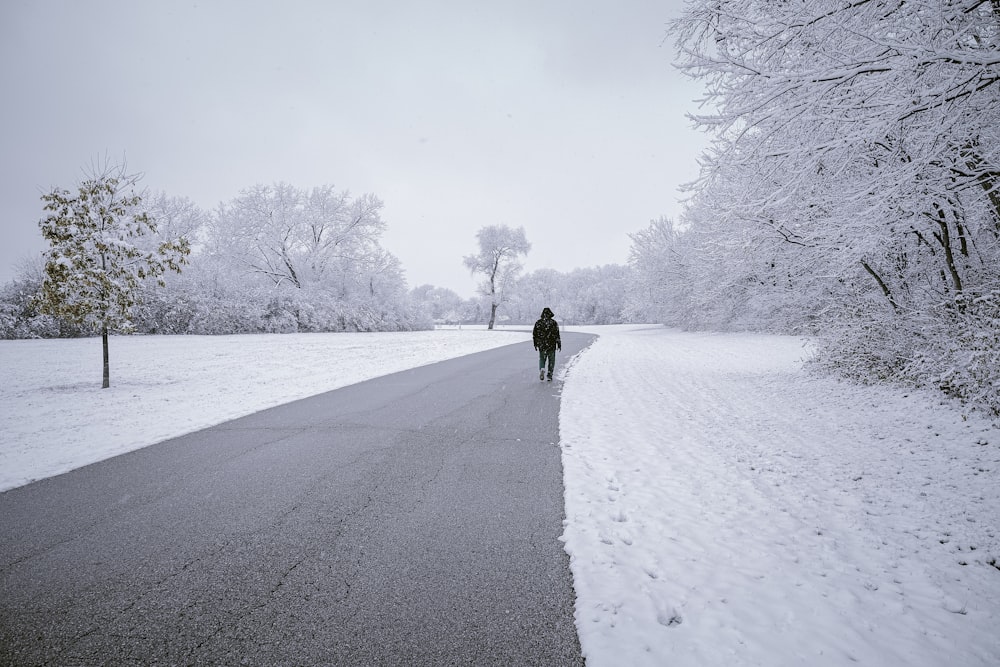 a person walking on a snowy road