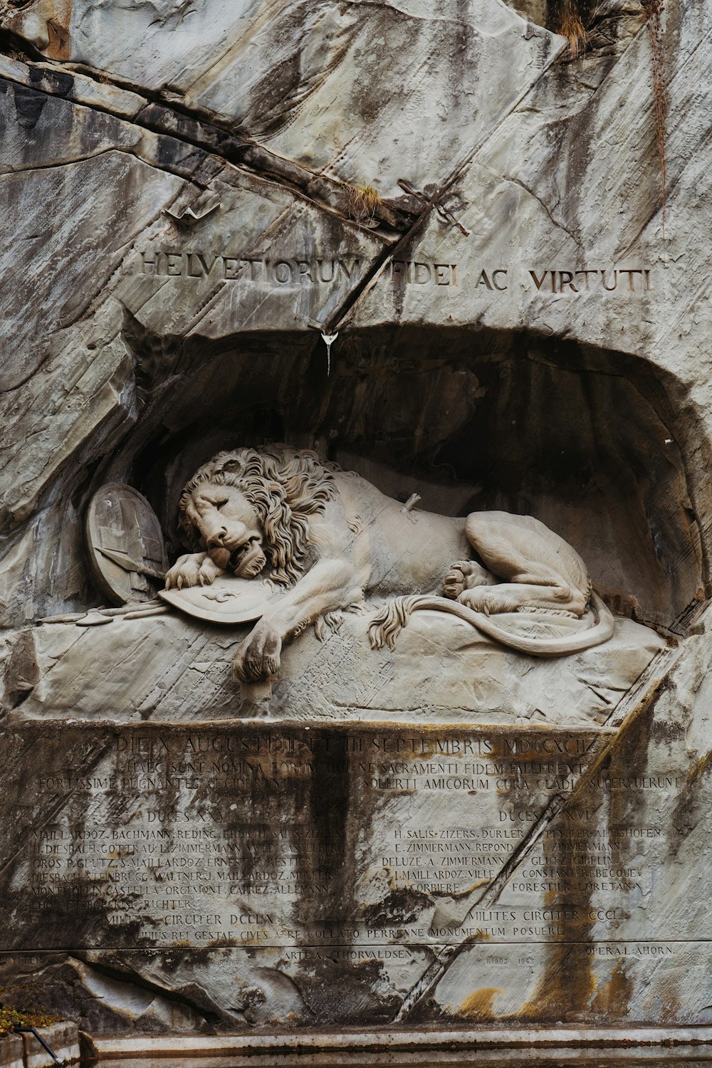 a stone sculpture of a lion