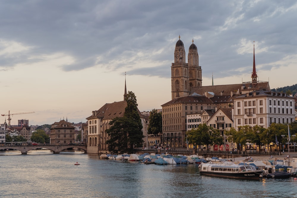 a body of water with boats in it and buildings around it