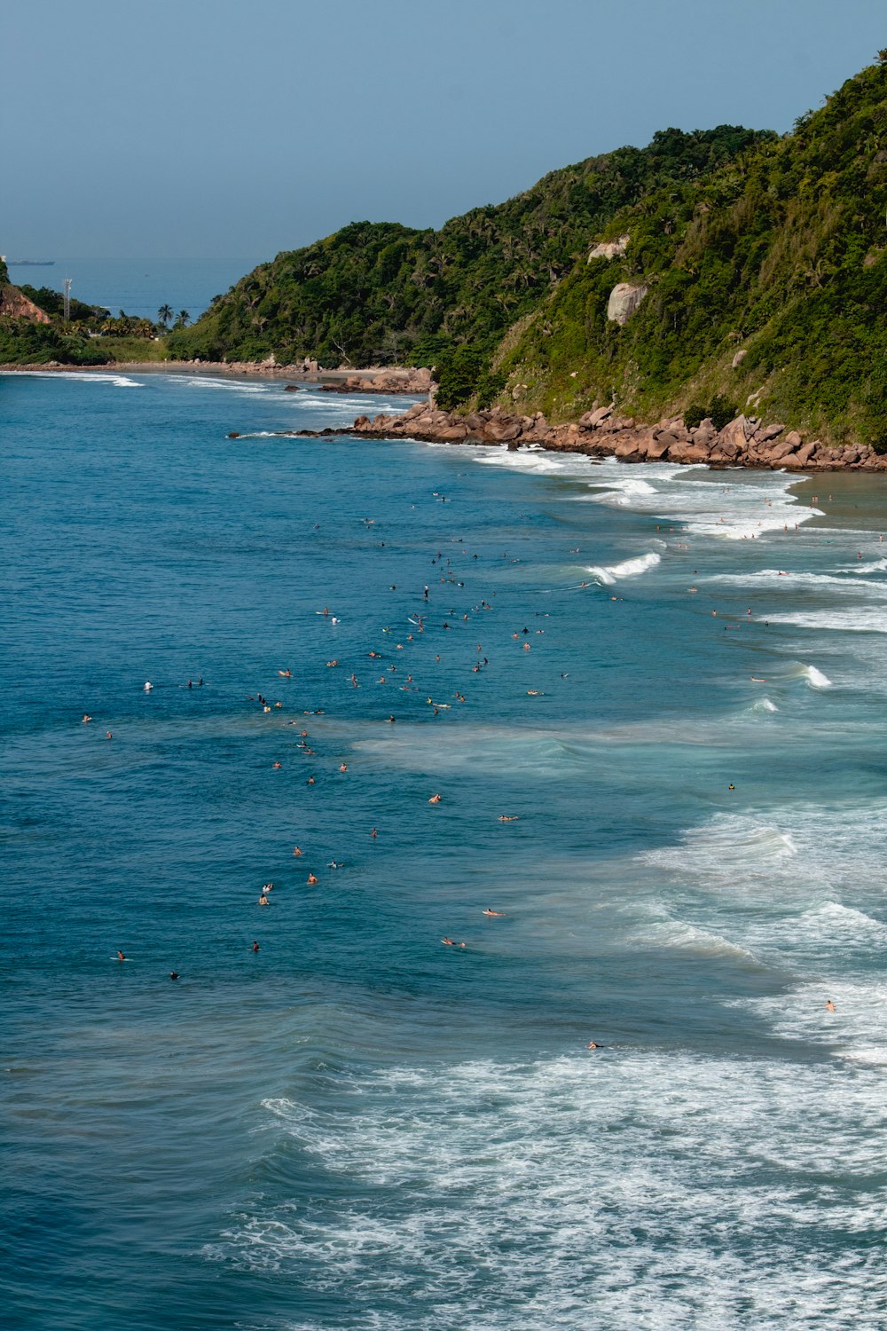 a group of people swimming in the ocean