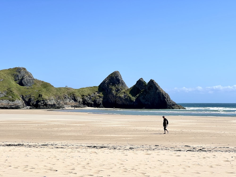 a person walking on a beach