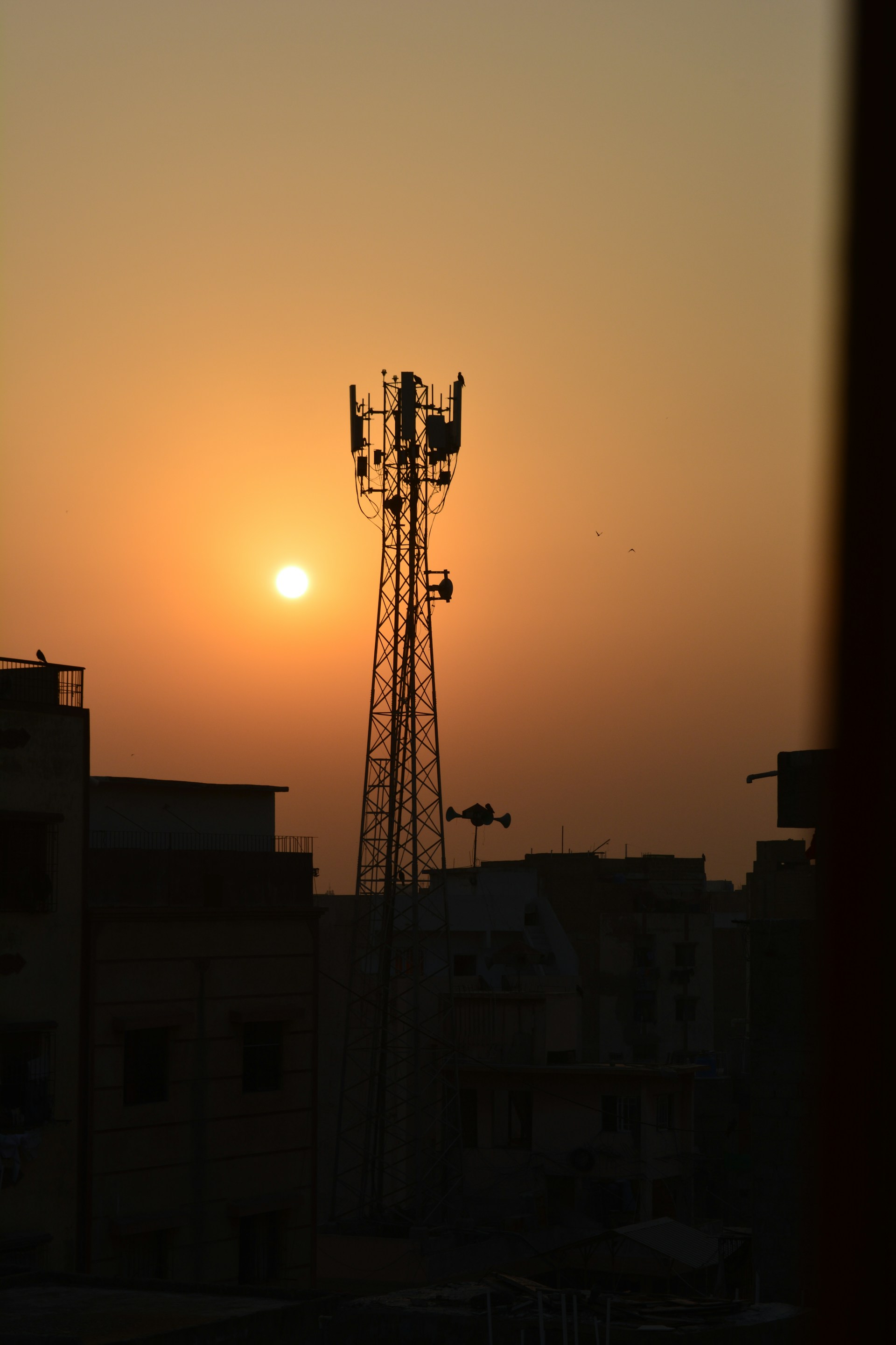a tall antenna on a building