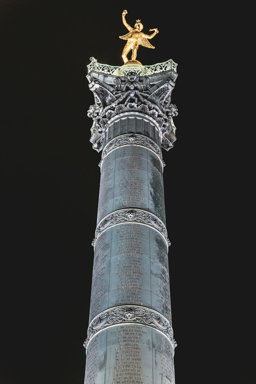 a statue on top of a tower