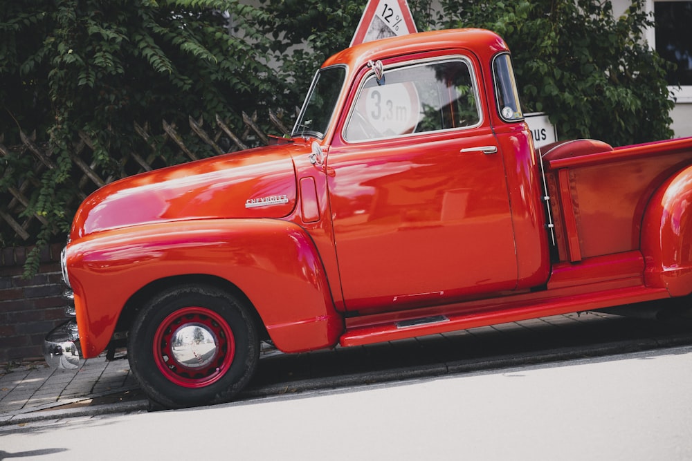 a red truck parked on a street