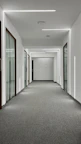 Hallway leading to rooms, clean and well-lit with modern design touches.