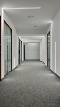 Hallway with a robust vinyl floor designed to handle heavy foot traffic.