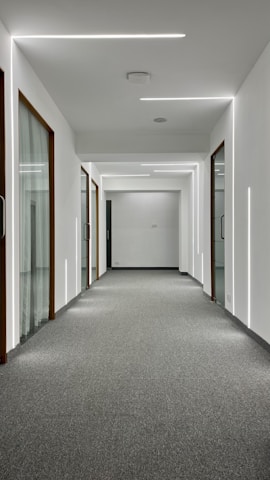 Wide shot of a bright, clean hallway carpet in a Los Angeles home.